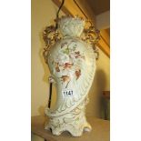 A Victorian Carlsbad Austria 16" two handled vase with hand painted flowers and leaves.
