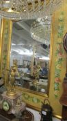 A large bevel edged mirror in hand painted frame, in good condition. *Collect Only*