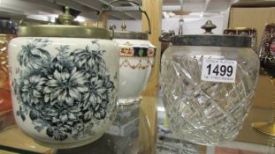 Two ceramic biscuit barrels and a glass biscuit barrel.