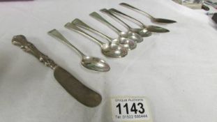 Seven silver spoons and a silver butter knife. 125 grams.