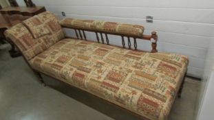 A mahogany chaise longue.