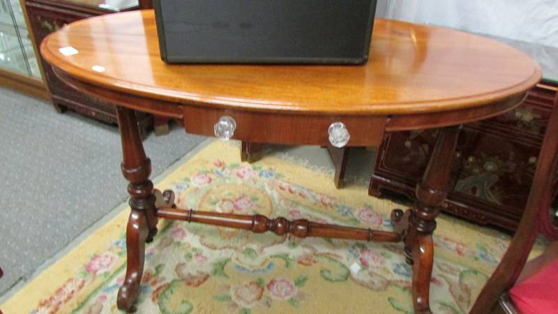An oval mahogany table.