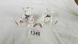 Two Royal Crown Derby seated bears.