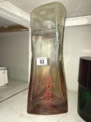A large Hugo Boss Pure Purple perfumery/chemist shop display bottle, height 34cm, (the contents