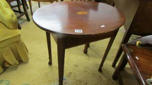 An Edwardian mahogany shell inlaid occasional table.