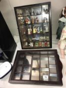 2 dark wood mirror backed small compartment trinket display cabinets and contents including Wade,