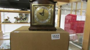 A boxed mantel clock by Burrell, Sheffield.