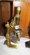 A cased brass microscope marked E Leitze Wetzlar, No. 49242.