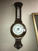 An Edwardian oak aneroid barometer COLLECT ONLY