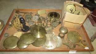 A box of assorted clock parts including pendulums.