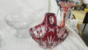 A pink glass lustre, a cut glass bowl and an overlaid glass basket.