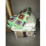 A double patchwork style bedcover with 2 pillow cases and a crocheted throw