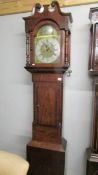 A mahogany 8 day Granfather clock with brass dial.