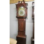 A mahogany 8 day Granfather clock with brass dial.