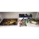 A Tutankhamun 4 x 96 piece jigsaw as a book, jigsaw rolling mat, playing cards and 1 other jigsaw