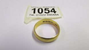 A 22ct gold wedding ring, size V, 6.5 grams.