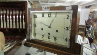 An art deco oak cased Westminster chime mantel clock with pendulum but no key.