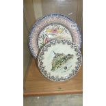 A Limoges 'Mont Saint Michel' plate and a large hand painted Portuguese plate.