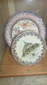 A Limoges 'Mont Saint Michel' plate and a large hand painted Portuguese plate.