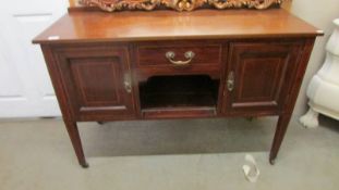 An Edwardian inlaid wash stand.