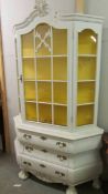 A painted display cabinet.