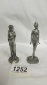 A pair of art deco style white metal figurines, 9 - 10 cm tall.