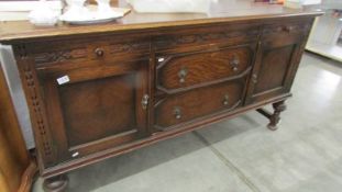 A large old oak sideboard.