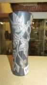 An unusual stone vase with 'silver' leaf decoration. Height 19cm.