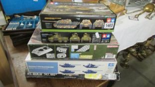 Five tank model kits and a model boat kit.