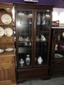 A dark oak effect display cabinet with etched glass doors (84cm x 32cm x 182cm high) (COLLECT ONLY)