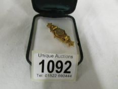 A Victorian 9ct gold bar brooch, 3 grams.
