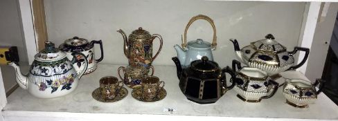 A quantity of teapots including Japanese hand painted tea set etc.