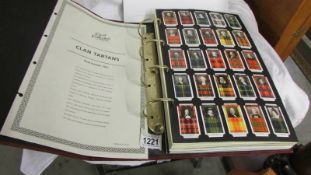 A Card Collector's Society album of cards including Clan Tartans, Uniforms, Railways etc.,