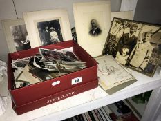 A good quantity of vintage black and white photographs includes birthday cards, anniversary cards