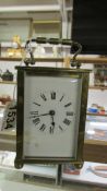 A brass carriage clock.