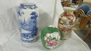 A Satsuma vase, a blue and white vase and one other.