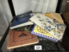 4 small stamp albums and a quantity of loose stamps