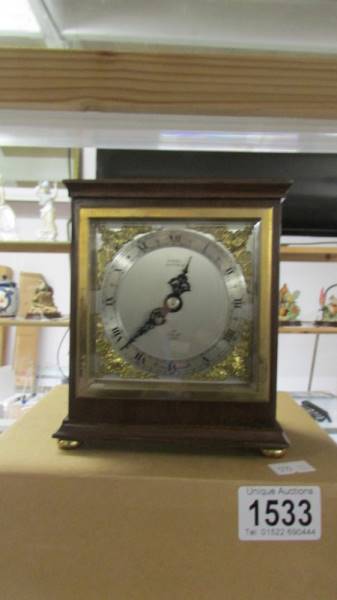 A boxed mantel clock by Burrell, Sheffield.