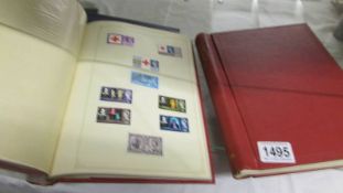 Four albums of assorted stamps.