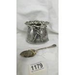 A silver sack shaped sugar bowl with silver spoon. 290 grams.