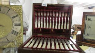 A cased set of twelve fish knives and forks.