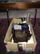 A box of miscellaneous including wall clock, enamel eggs & torches etc.