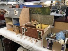 3 incomplete Doll's House buildings. A box of dolls furniture and some scenery back boards