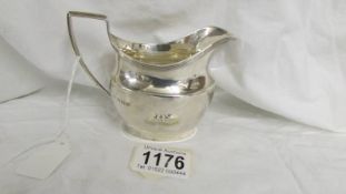 A silver cream jug, 115 grams.