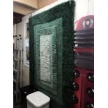 A deep pile variegated green rug (188cm long x 130cm wide) (COLLECT ONLY)