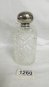 A cut glass scent bottle with silver top. Birmingham 1904.