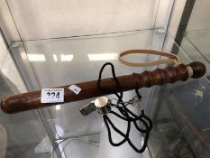 A police truncheon and whistle