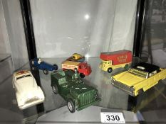 A selection of tin plate and plastic friction toys, including Triang, tank, jeep, ambulance etc