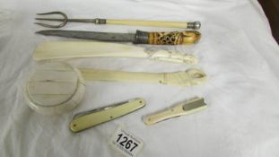 Seven pieces of antique ivory including shoe horn, letter opener, pickle fork etc.,