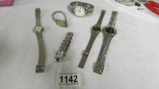 Six wrist watches including Camel, Omega, Cartier etc.,